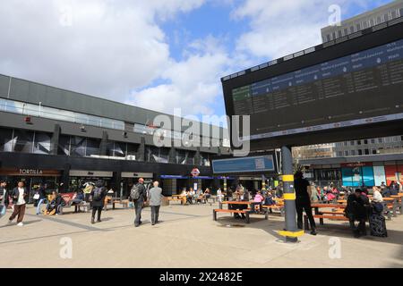 Euston plaza in front of the train station, with the departure board, in north London, UK Stock Photo