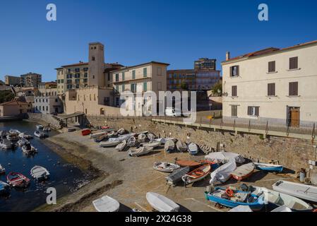 The marina of Piombino, Tarsinata (protected dock) and the church of Sant'Antimo, Piombino, Tuscany, Italy Stock Photo