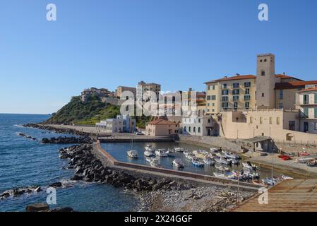 The marina of Piombino, Tarsinata (protected dock) and the church of Sant'Antimo, Piombino, Tuscany, Italy Stock Photo