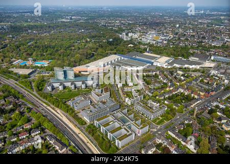 Luftbild, Messe Essen Gelände, Eon Zentrale und Gewerbegebiet Bürohäuser Messeallee, hinten der Grugapark mit Freibad Grugabad, Rüttenscheid, Essen, Ruhrgebiet, Nordrhein-Westfalen, Deutschland ACHTUNGxMINDESTHONORARx60xEURO *** Aerial view, Messe Essen site, Eon headquarters and commercial area office buildings Messeallee, behind the Grugapark with outdoor pool Grugabad, Rüttenscheid, Essen, Ruhr area, North Rhine-Westphalia, Germany ACHTUNGxMINDESTHONORARx60xEURO Stock Photo