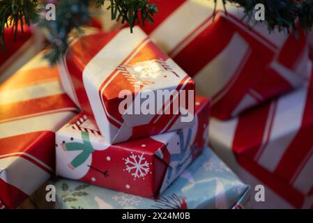 Wrapped Christmas gifts under the tree Stock Photo