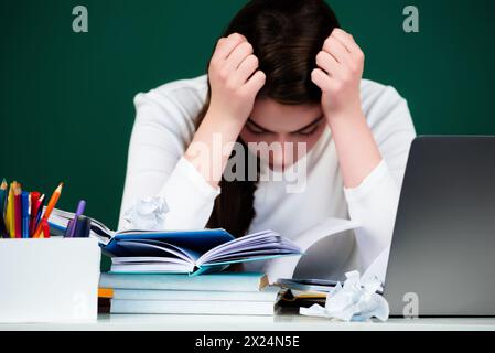 Student in high school classroom. Knowledge in high school. High school or university concept. Young College student study near blackboard. Education Stock Photo