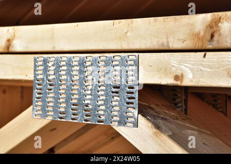 Hot dipped galvanized connector plates for wood structure truss and joist. Stock Photo