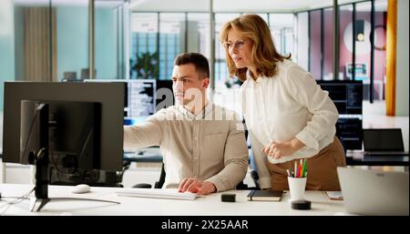 Business People Training On Computer. Young Woman In Office Stock Photo