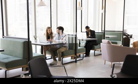 Diverse freelance project managers working at computers Stock Photo