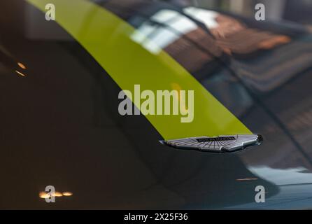A picture of the Aston Martin logo on the hood of a car. Stock Photo