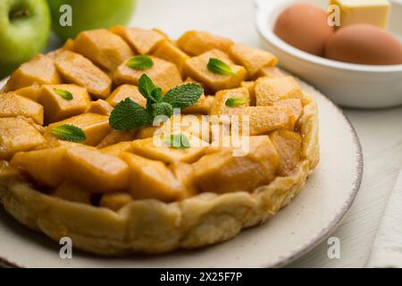 Tarte Tatin is a variant of apple pie in which the apples have been caramelized in butter and sugar before adding the dough. Stock Photo