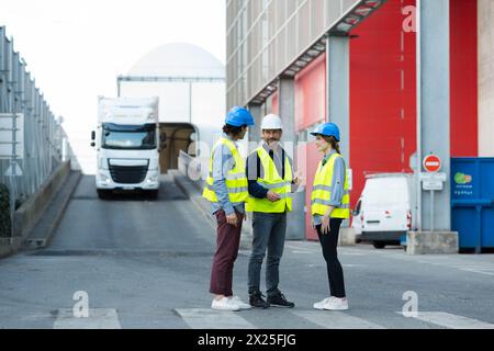 three construction engineers working outdoors Stock Photo