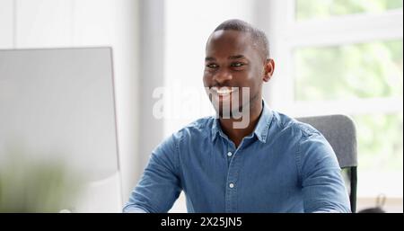African American man using computer for business communication. Stock Photo