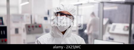 Woman engineer using tablet in medical engineering factory Stock Photo