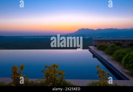 Sunset long exposure blue hour shot with pool and grass in Kas Antalya Stock Photo