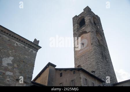 Romanesque Torre Civica (Civic Tower) from XI to XII century on Piazza Vecchia in historic centre called Bergamo Upper City in Bergamo, Province of Be Stock Photo
