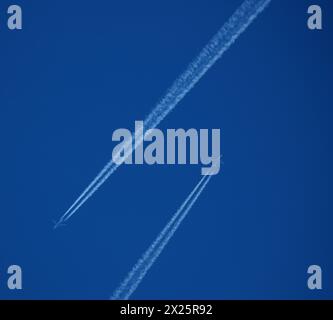 two parallel airplane tracks in the blue sky, contrails Stock Photo - Alamy
