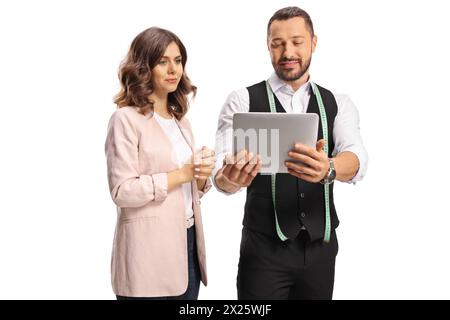 Tailer and a young woman looking at a digital tablet isolated on white background Stock Photo