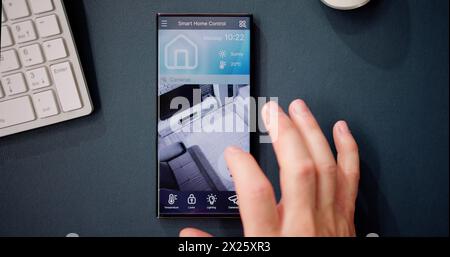 Smart Home CCTV Security On Mobile Phone Or Smartphone Stock Photo