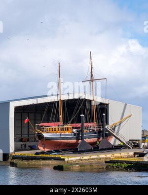 Buckie Harbour, Moray, UK. 19th Apr, 2024. This is the Sailing Boat, Kommandoren bearing a UK Flag dry docked at Macduff Shipyards in Buckie. This Baltic Trader was built in 1891 and is currently owned by Hays Ships. Credit: JASPERIMAGE/Alamy Live News Stock Photo