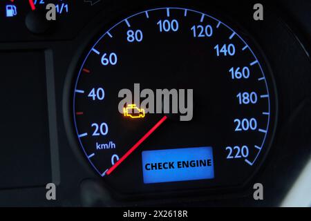 Check engine error light illuminated on car dashboard Stock Photo