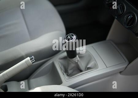 Manual gearbox transmission gear shifter knob handle stick shift in the car interior Stock Photo
