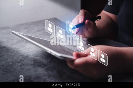 Business woman use digital tablet for human resource management and recruitment business. Stock Photo