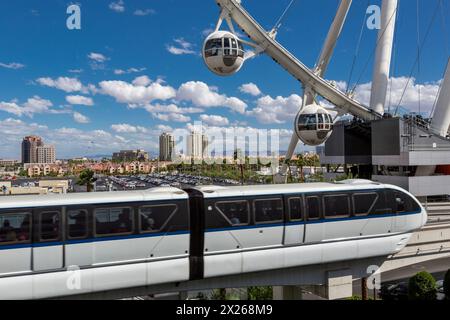 Las Vegas, Nevada.  Monorail, with High Roller in background.  The High Roller is the world's tallest observation wheel, as of 2015.  Urban growth in Stock Photo