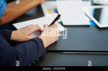 Person, hand and pen with paper for sign, agreement and writing for note taking, deal and idea for professional career. Pen, stationery and write for Stock Photo