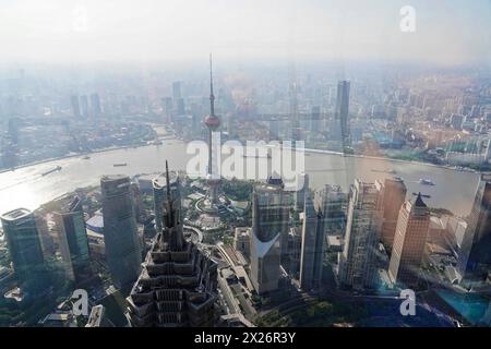 View from the 632 metre high Shanghai Tower, nicknamed The Twist, Shanghai, People's Republic of China, aerial view of a veiled city with skyscrapers Stock Photo
