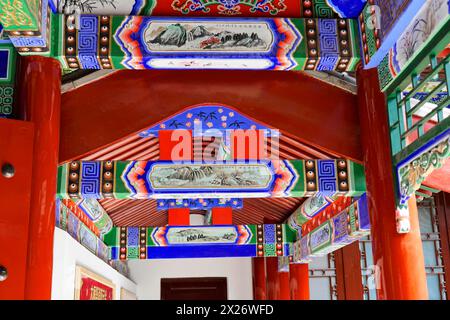 Chongqing, Chongqing Province, China, Asia, Ornamented ceiling with traditional paintings in a Chinese gallery Stock Photo