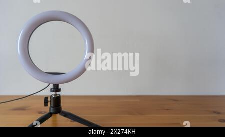 Versatile ring light on sleek tripod Stock Photo