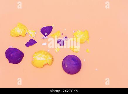 Multi-colored eggshell from Easter eggs on a pink background. Happy easter concept Stock Photo
