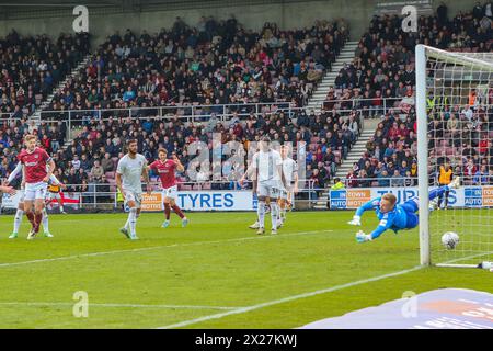 Northampton 20 April 2022:Northampton Town's Jon Guthrie shot beats Exeter City's Viljami Sinisalo to score Northampton's equalising goal in the EFL Division 1 Northampton Town v Exeter City Credit: Clive Stapleton/Alamy Live News Stock Photo