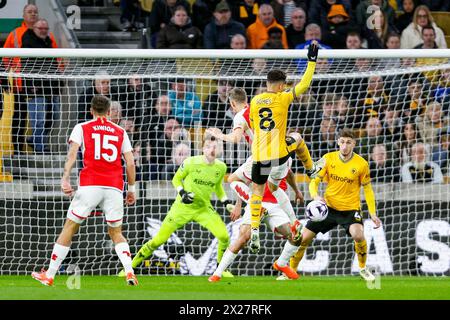 Wolverhampton, UK. 20th Apr, 2024. Leandro Trossard of Arsenal & João Gomes of Wolves battle in the air during the Premier League match between Wolverhampton Wanderers and Arsenal at Molineux, Wolverhampton, England on 20 April 2024. Photo by Stuart Leggett. Editorial use only, license required for commercial use. No use in betting, games or a single club/league/player publications. Credit: UK Sports Pics Ltd/Alamy Live News Stock Photo