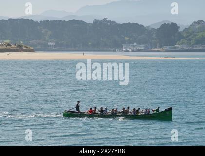 A traditional Cantabrian trainera racing rowing boat training in the bay of Santander Cantabria Spain Europe Stock Photo