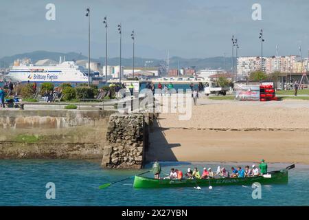 A traditional Cantabrian trainera racing rowing boat approaching the beach after training in the bay of Santander Cantabria Spain Europe Stock Photo