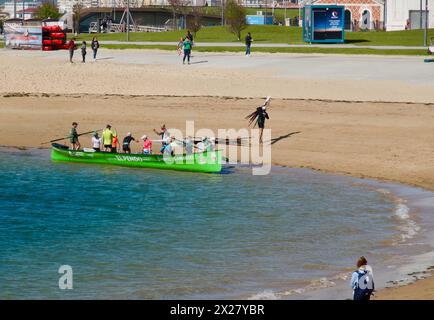 A traditional Cantabrian trainera racing rowing boat disembarking after training in the bay of Santander Cantabria Spain Europe Stock Photo