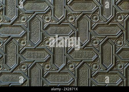 Islamic patterns and Arabic calligraphy of the Seville Cathedral door, Spain. Stock Photo