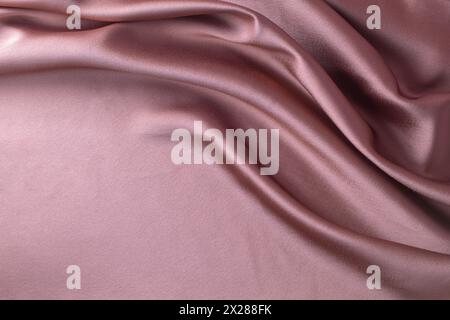 Smooth elegant pink silk or satin luxury cloth texture can use as abstract background. Luxurious background design Stock Photo