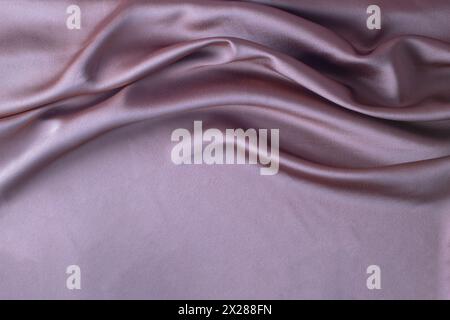 Smooth elegant pink silk or satin luxury cloth texture can use as abstract background. Luxurious background design Stock Photo
