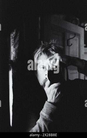 Man taking self-portrait photo in mirror Stock Photo