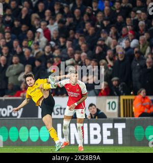 Wolverhampton, UK. 20th Apr, 2024. Hugo Bueno of Wolves battles with Ben White of Arsenal during the Premier League match between Wolverhampton Wanderers and Arsenal at Molineux, Wolverhampton, England on 20 April 2024. Photo by Stuart Leggett. Editorial use only, license required for commercial use. No use in betting, games or a single club/league/player publications. Credit: UK Sports Pics Ltd/Alamy Live News Stock Photo