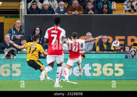Wolverhampton, UK. 20th Apr, 2024. Hugo Bueno of Wolves crosses to the centre during the Premier League match between Wolverhampton Wanderers and Arsenal at Molineux, Wolverhampton, England on 20 April 2024. Photo by Stuart Leggett. Editorial use only, license required for commercial use. No use in betting, games or a single club/league/player publications. Credit: UK Sports Pics Ltd/Alamy Live News Stock Photo