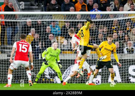 Wolverhampton, UK. 20th Apr, 2024. Leandro Trossard of Arsenal & João Gomes of Wolves battle in the air during the Premier League match between Wolverhampton Wanderers and Arsenal at Molineux, Wolverhampton, England on 20 April 2024. Photo by Stuart Leggett. Editorial use only, license required for commercial use. No use in betting, games or a single club/league/player publications. Credit: UK Sports Pics Ltd/Alamy Live News Stock Photo