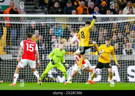 Wolverhampton, UK. 20th Apr, 2024. Leandro Trossard of Arsenal & João Gomes of Wolves battle in the air during the Premier League match between Wolverhampton Wanderers and Arsenal at Molineux, Wolverhampton, England on 20 April 2024. Photo by Stuart Leggett. Editorial use only, license required for commercial use. No use in betting, games or a single club/league/player publications. Credit: UK Sports Pics Ltd/Alamy Live News Stock Photo