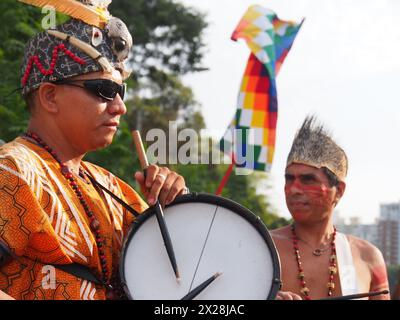 Lima, Peru. 20th Apr, 2024. Amazonian indigenous people playing drums when when dozens of demonstrators and environmentalists took to the streets, demonstrating for the recent modifications to the forestry law that would facilitate the deforestation of the Amazon and illegal logging Credit: Fotoholica Press Agency/Alamy Live News Stock Photo