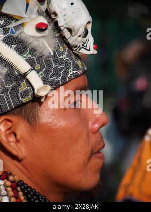 Lima, Peru. 20th Apr, 2024. Amazonian indigenous man with headdress participating when dozens of demonstrators and environmentalists took to the streets, demonstrating for the recent modifications to the forestry law that would facilitate the deforestation of the Amazon and illegal logging Credit: Fotoholica Press Agency/Alamy Live News Stock Photo