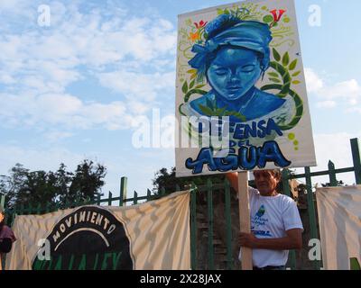 Lima, Peru. 20th Apr, 2024. 'Water defense' can be read on a banner when dozens of demonstrators and environmentalists took to the streets, demonstrating for the recent modifications to the forestry law that would facilitate the deforestation of the Amazon and illegal logging Credit: Fotoholica Press Agency/Alamy Live News Stock Photo