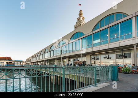 San Francisco, California, April 8, 2024. The Ferry Building in San Francisco viewed from the waterfront, showing its marketplace and iconic tower Stock Photo