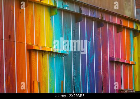 Rainbow colour painted port of a large warehouse Stock Photo