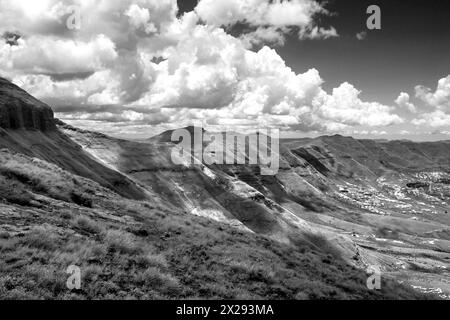 Clouds Gathering along a mountain ridge in Drakensberg Mountains on the border between Lesotho and South Africa in Black and White Stock Photo