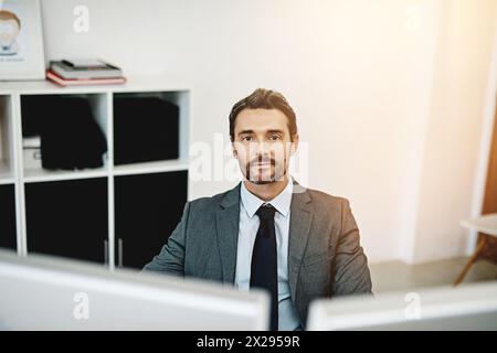 Business man, computer and portrait in office for information technology, software or programming at startup company. Face of programmer or web Stock Photo