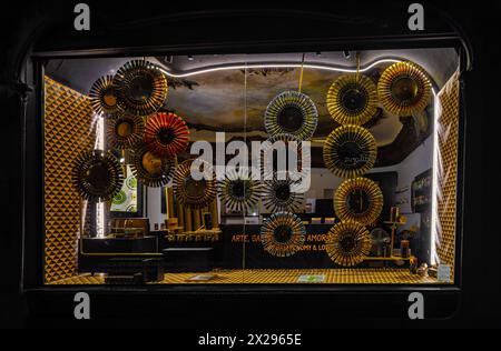Beautifully decorated showcase with tubes of acrylic and oil paint creating circles of gold and metallic colors from an art supply store. Stock Photo